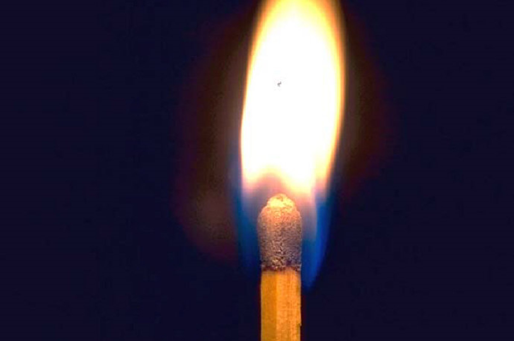 Single burning wooden match.jpg